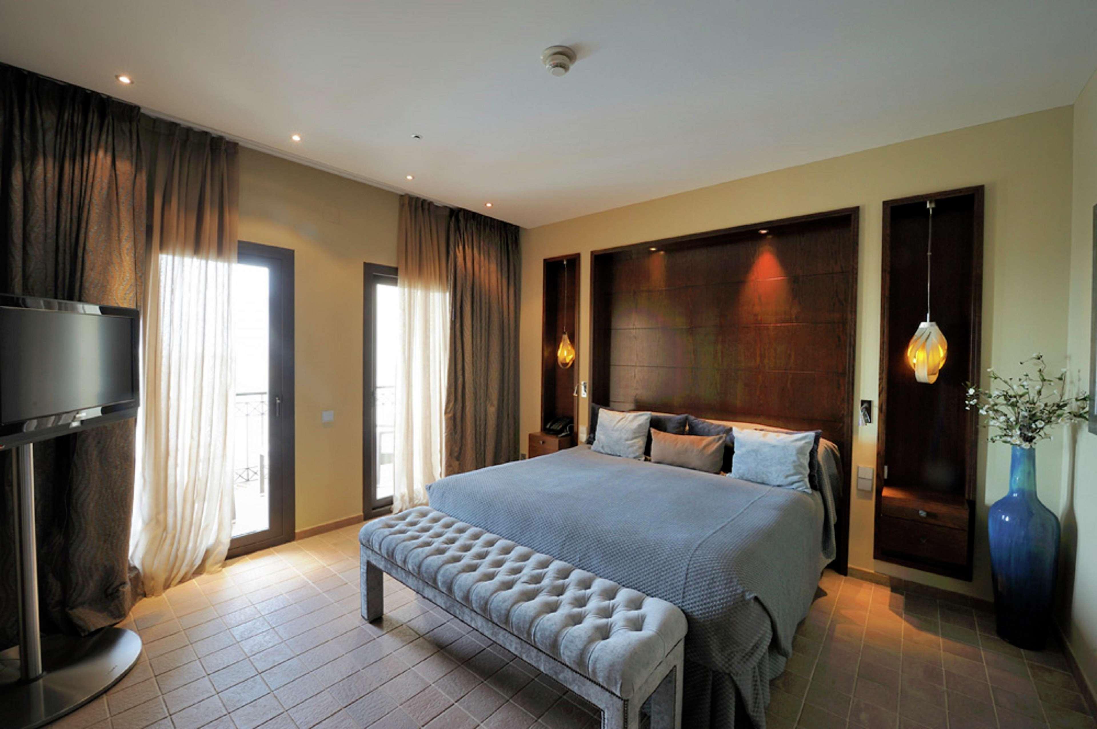 Doubletree By Hilton La Torre Golf Resort Roldan Luaran gambar A bedroom at the hotel